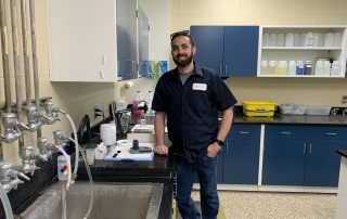Male in water quality lab in SJRA uniform
