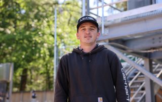 Male with a SJRA hat and blue jacket