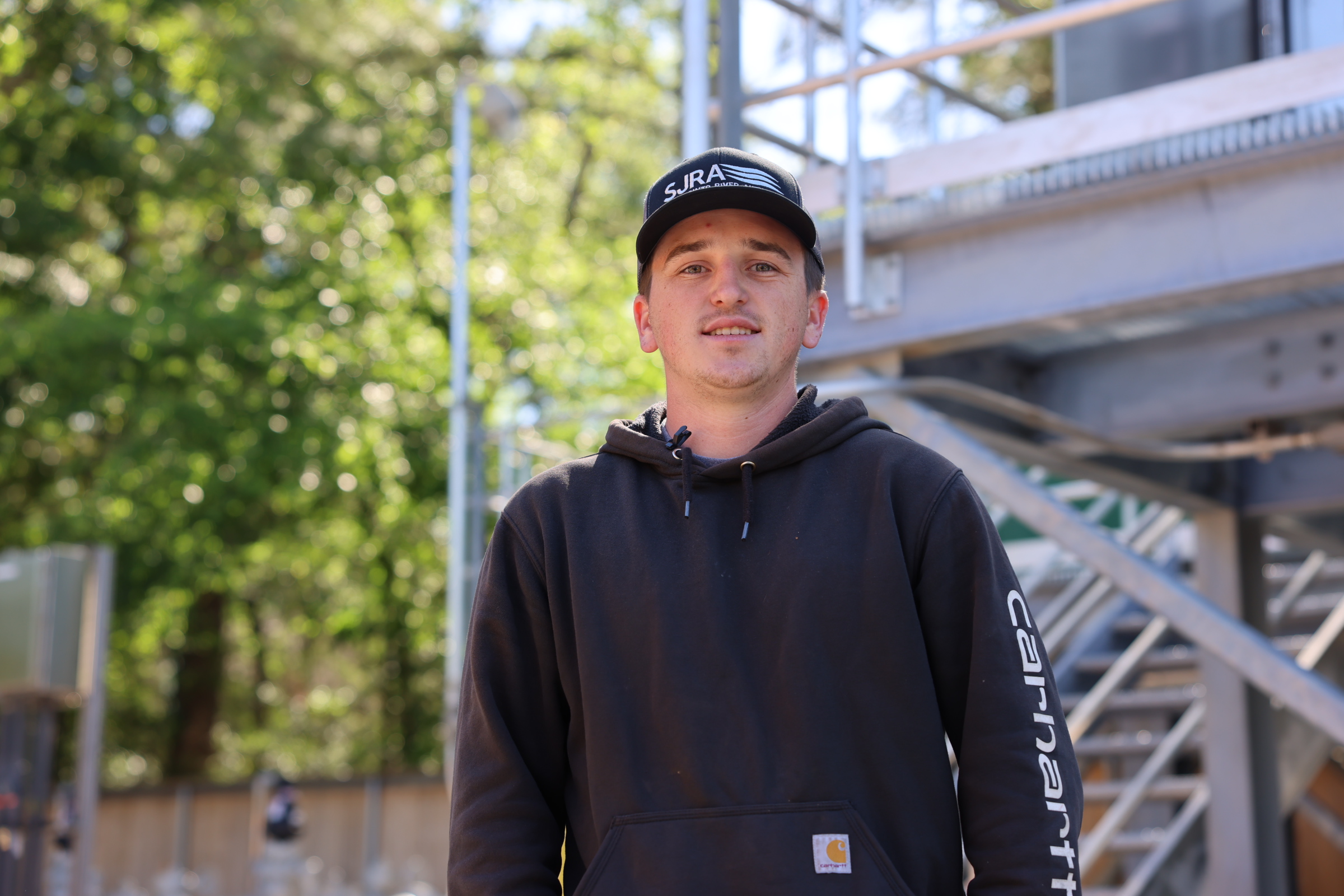 Male with a SJRA hat and blue jacket