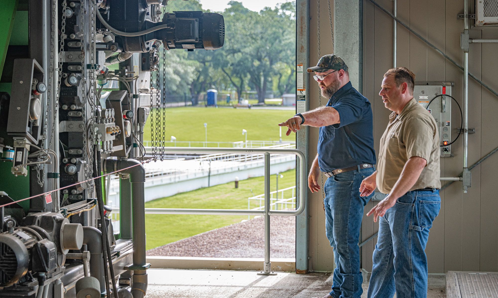 WWTF Two males in a room at the wastewater treatment facility